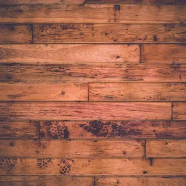 A wooden floor with some brown wood planks