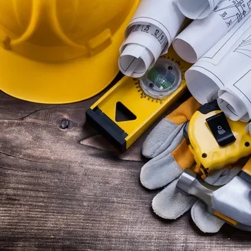 A construction site with tools and equipment on the table.