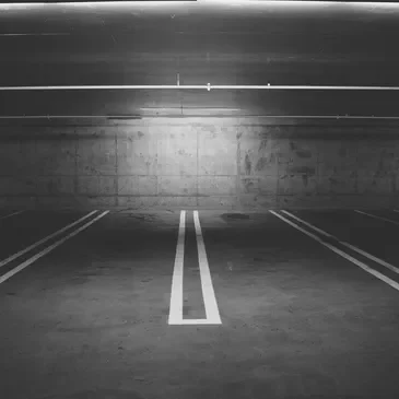 A parking lot with two lines painted on it.