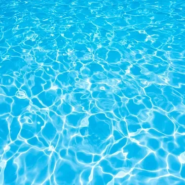 A pool with blue water and ripples.