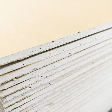 A close up of the bottom edge of a stack of paper